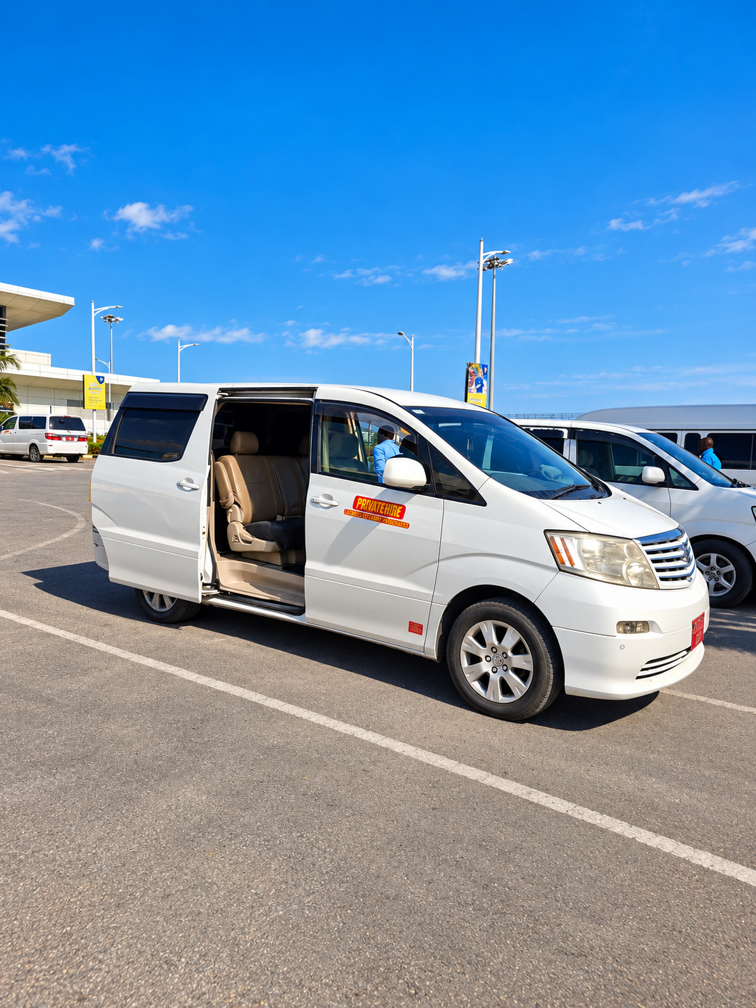 KeY 2 You private transfer van waiting at Zanzibar airport arrivals
